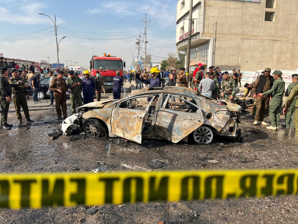 Broken glass and car debris were left across the road