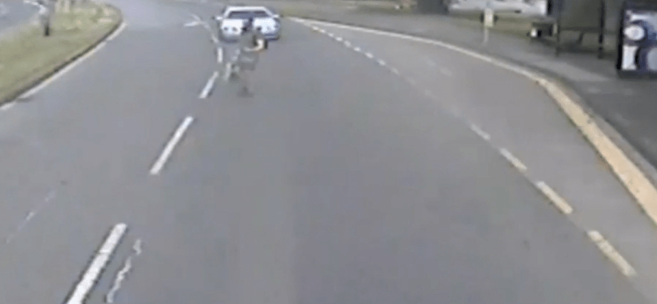 CCTV shows Layton walking in front of his car