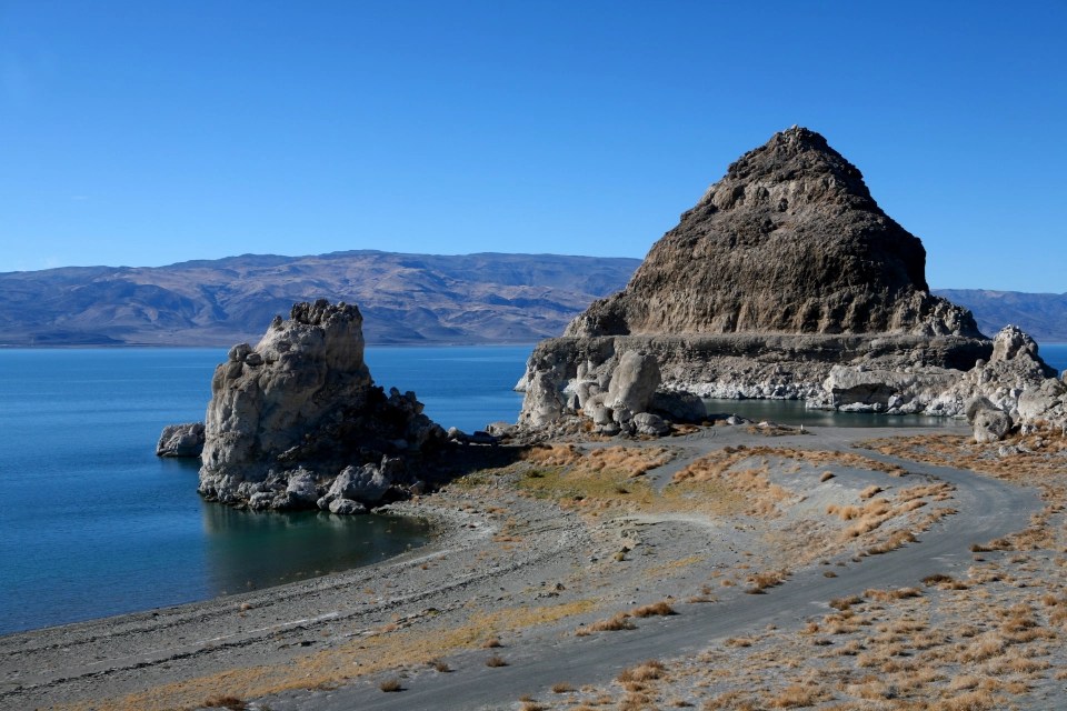 The area surrounding the lake is said to be made up of several different peaks, beaches and forests
