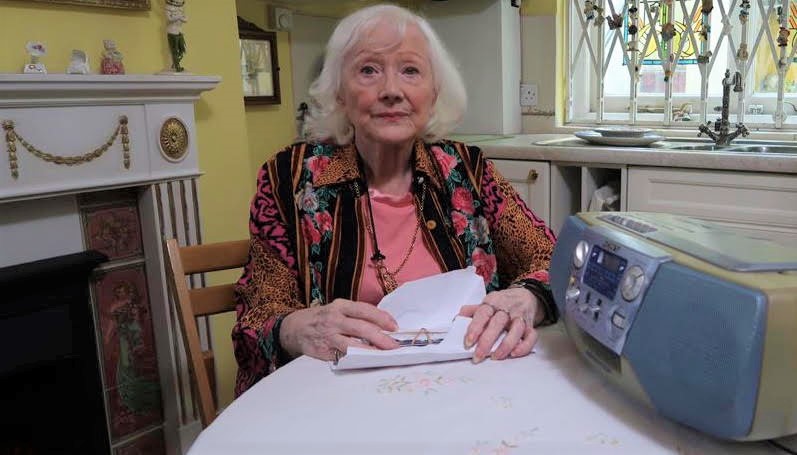 Janie with letters she received from the two killers