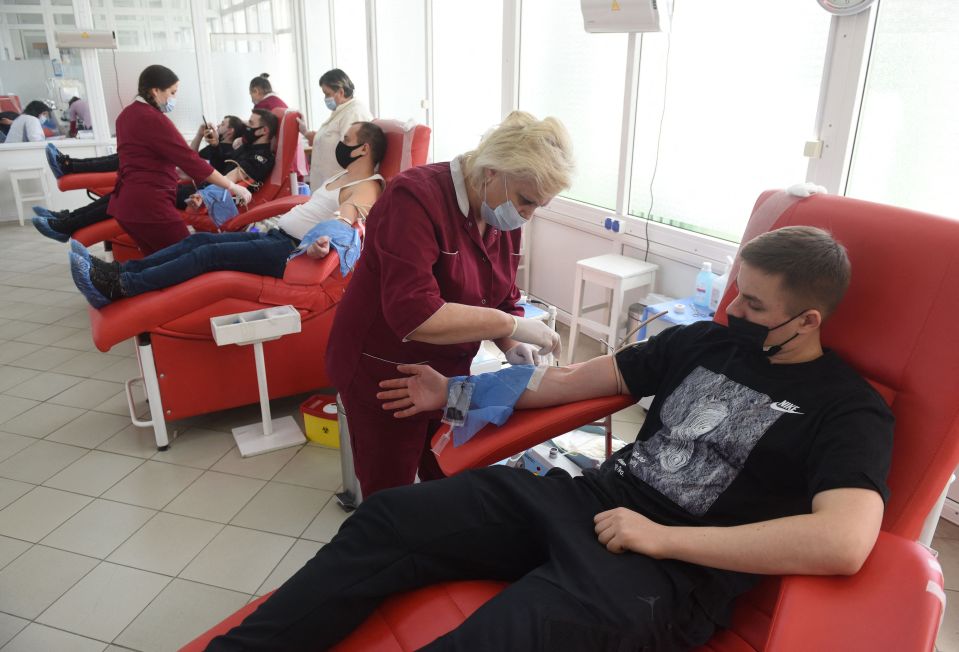 People donate blood for the army at the Blood Service Center in the western Ukrainian city of Lviv