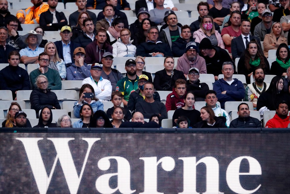 Spectators in the stands attend the state memorial service
