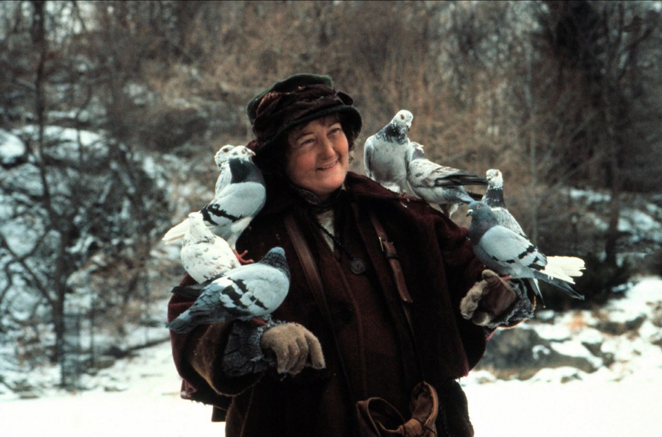 Brenda Fricker holding several pigeons in Home Alone 2: Lost in New York.