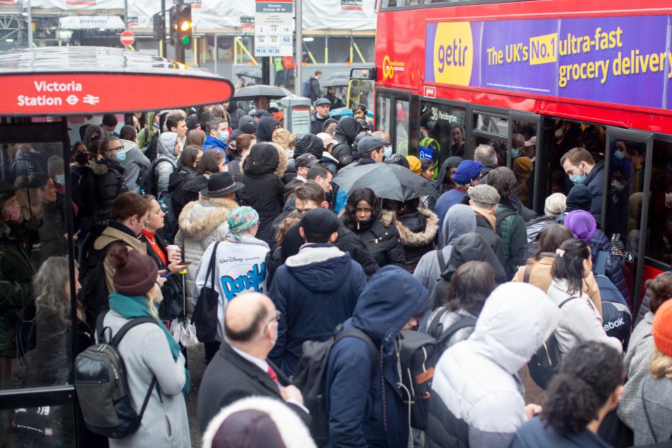 Passengers caught up in the tube strike wait for buses at Victoria Station
