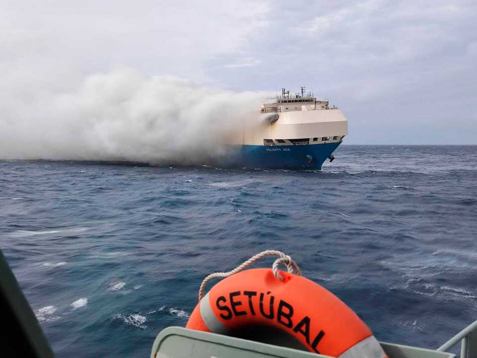 Tugboats had been firefighting equipment to try to cool the ship's hull