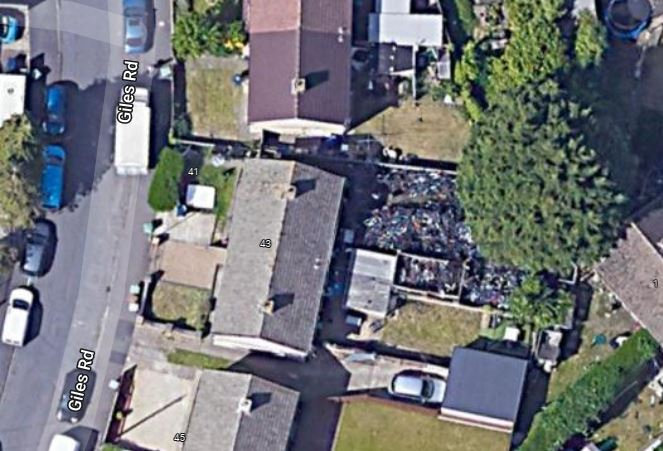 A huge mountain of bikes stashed in a garden can be seen on Google Earth