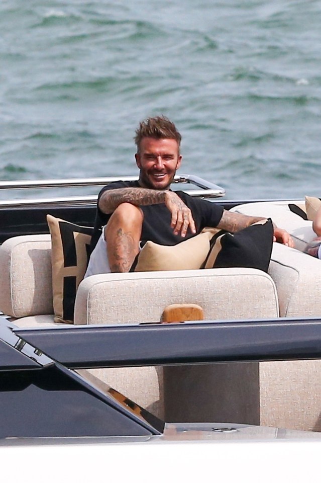 David Beckham relaxes on a yacht in Miami ahead of the big day