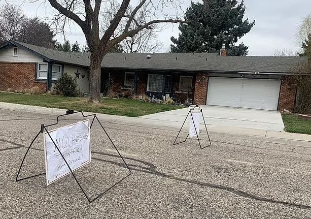 A "cranky" neighbour of a seemingly busy Airbnb has caused a stir online after photos of his efforts to keep visitors away went viral