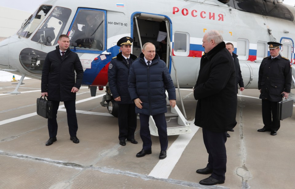 Putin alongside the alleged Russian nuclear briefcase as he met with ally Alexander Lukashenko