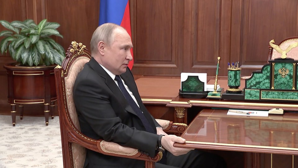 The Russian tyrant has been seen gripping a desk