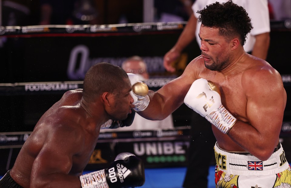 a man wearing a pair of boxing gloves with the word odd on them
