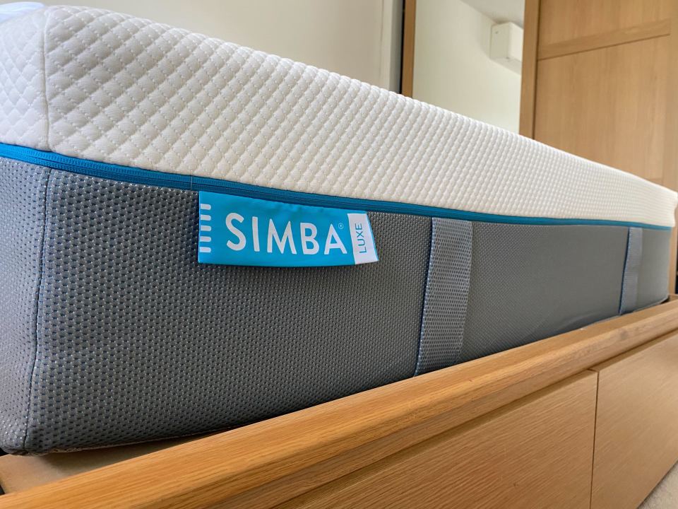 a simba luxe mattress sits on a wooden dresser