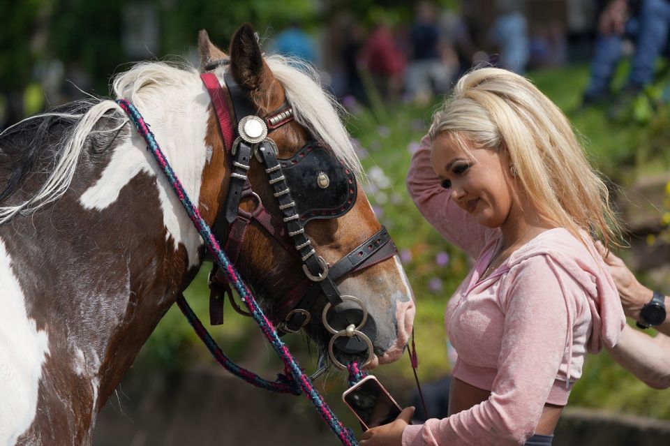 The woman seemed to take good care of her horse on the second day of the fair