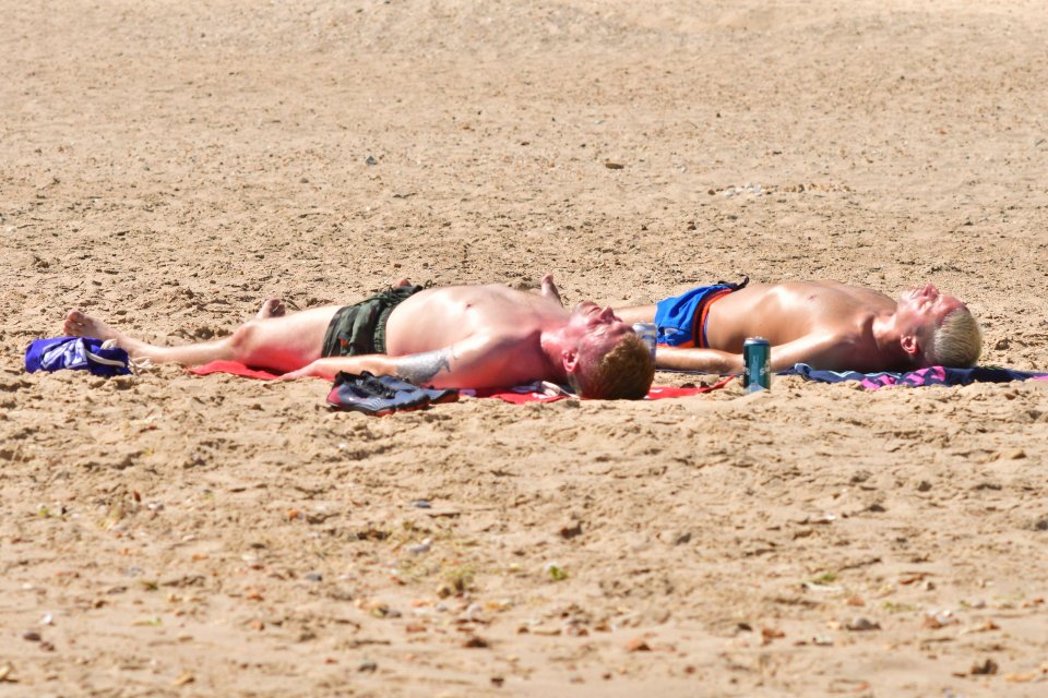 Pals soak up the sun in Bournemouth, Dorset