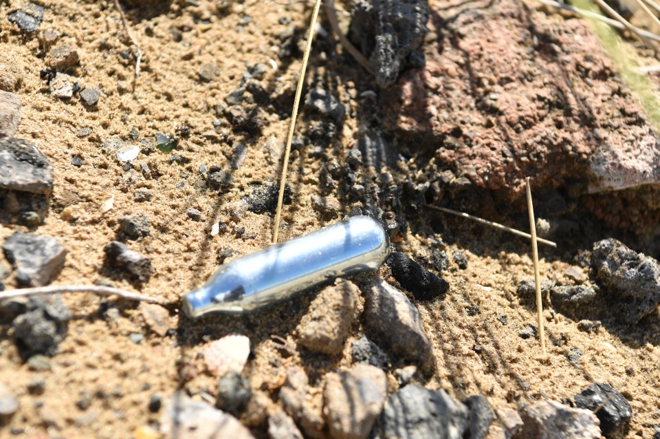 Gas cannisters have been left on the idyllic beach