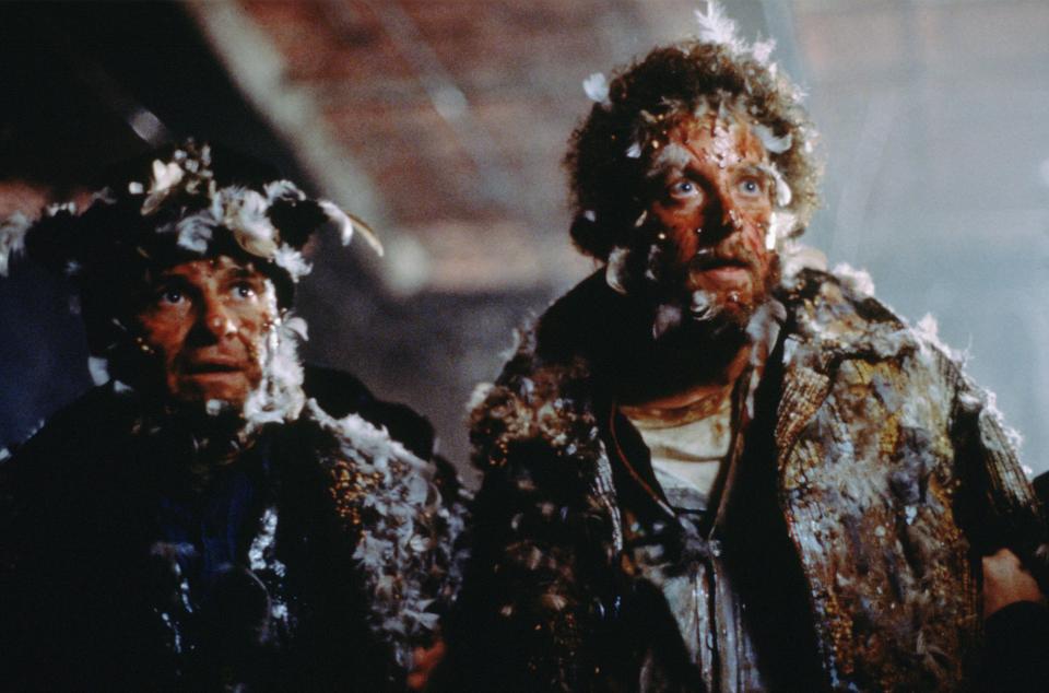 The pair are left covered in feathers after falling victim to a prank