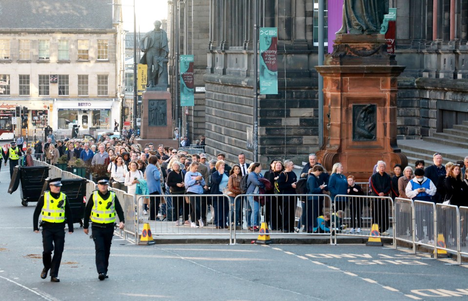 Police were on hand to monitor crowds first thing after they queued through the night