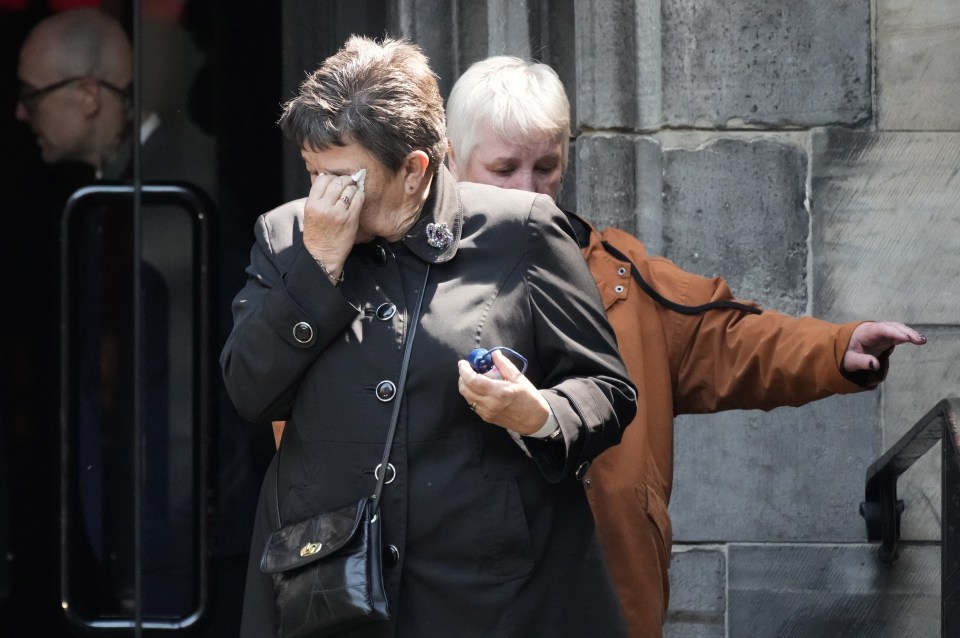 One woman was overcome by emotion when she filed past