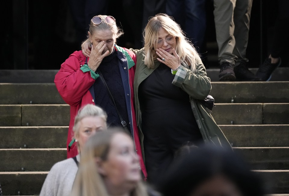 Two women consoled each other after fighting back tears
