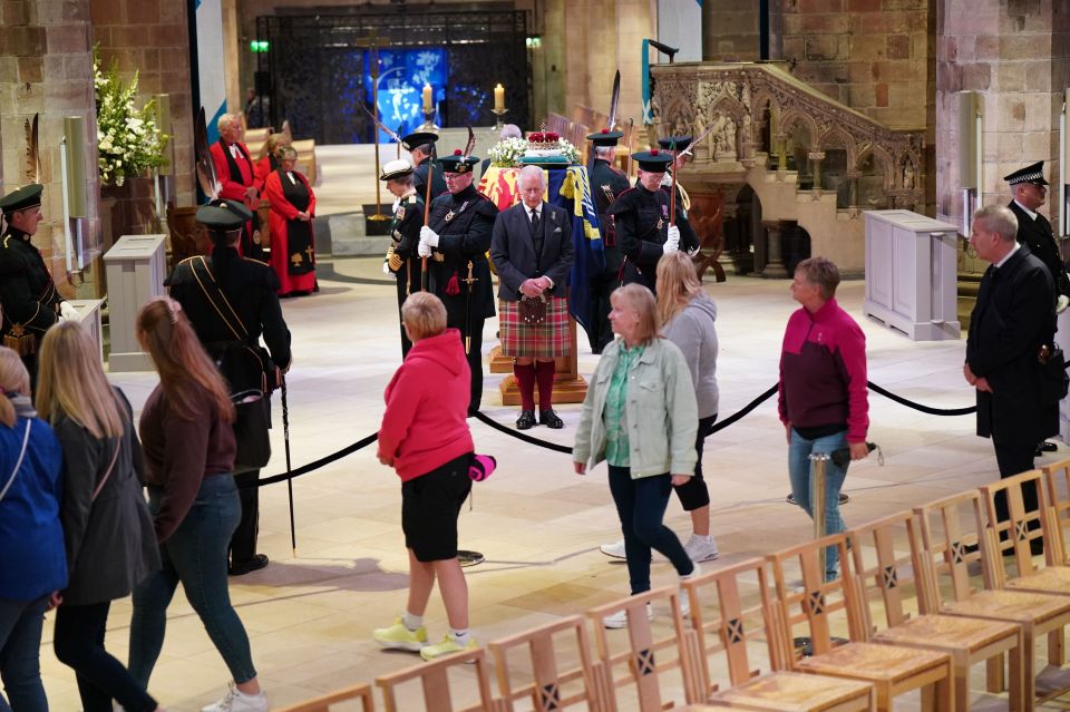 Mourners filed past as King Charles and his siblings stood guard
