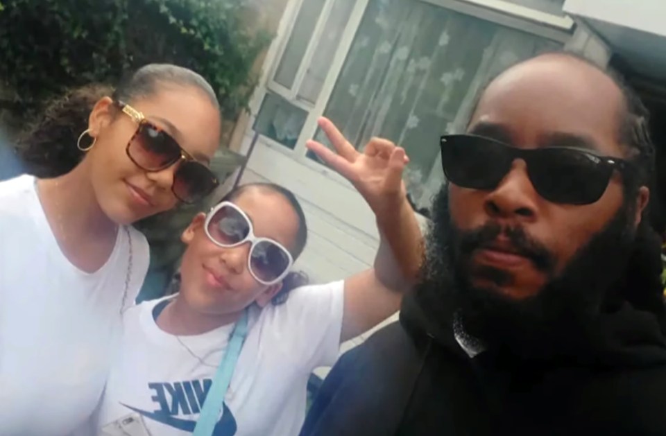 Kyra Hill, centre, with her dad Leonard and elder sister