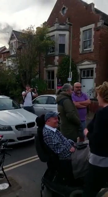 The protestors prevented a BMW driver from accessing the road
