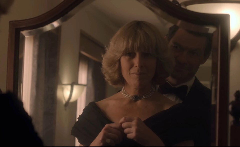 Charles is seen embracing Camilla