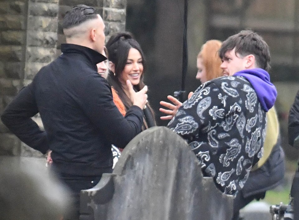 Michelle had a giggle with the cast as they recorded funeral scenes for her character's ex