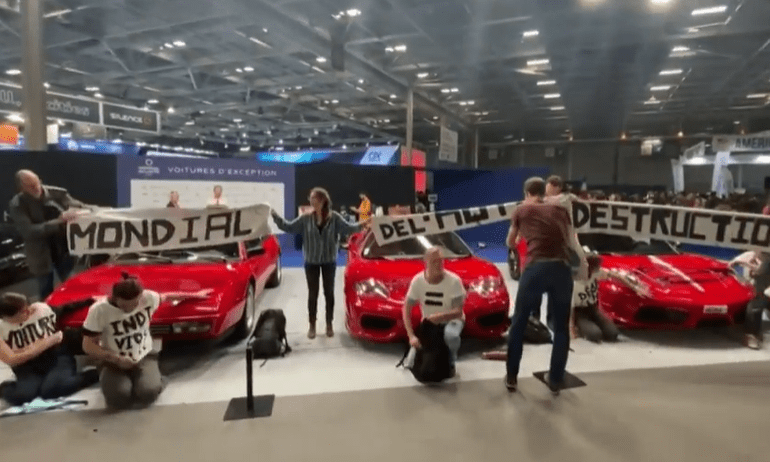The eco-idiots stormed the Paris Motor Show and glued themselves to Ferraris