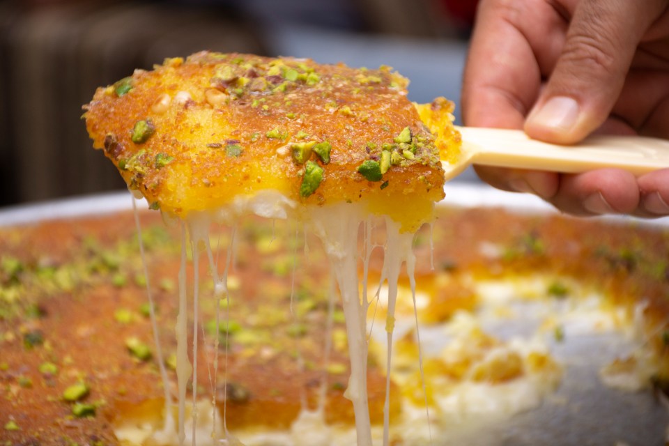 Sample the local 'Knafeh', a snack made of white cheese and pistachio