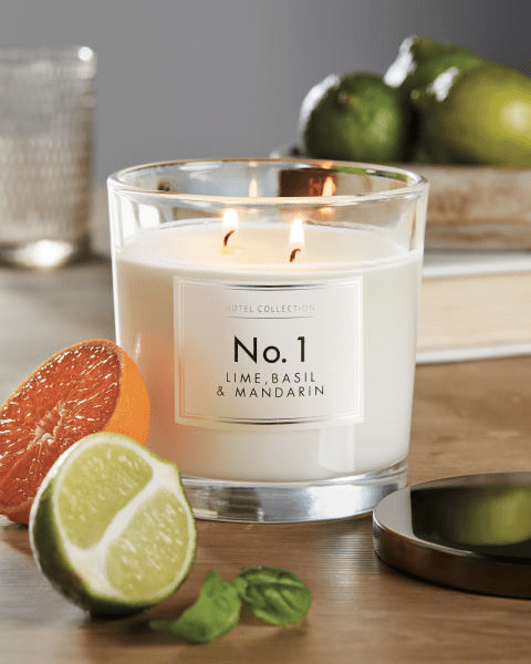 Three-wick candle in glass jar, labeled "No. 1 Lime, Basil & Mandarin".