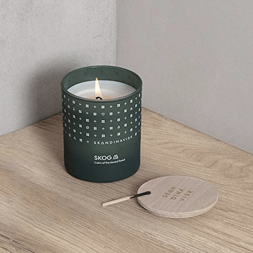 Lit Skog candle by Skandinavisk.