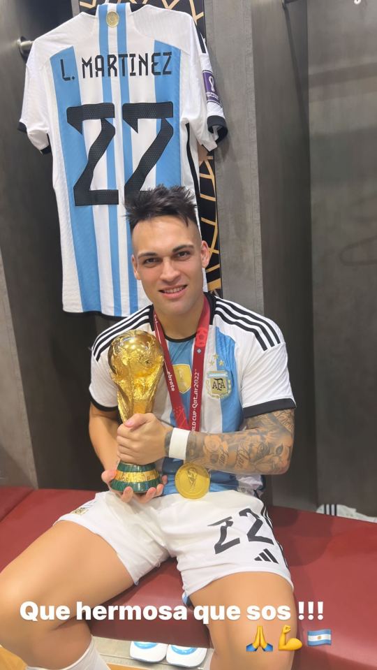 Martinez with the World Cup trophy in the dressing room