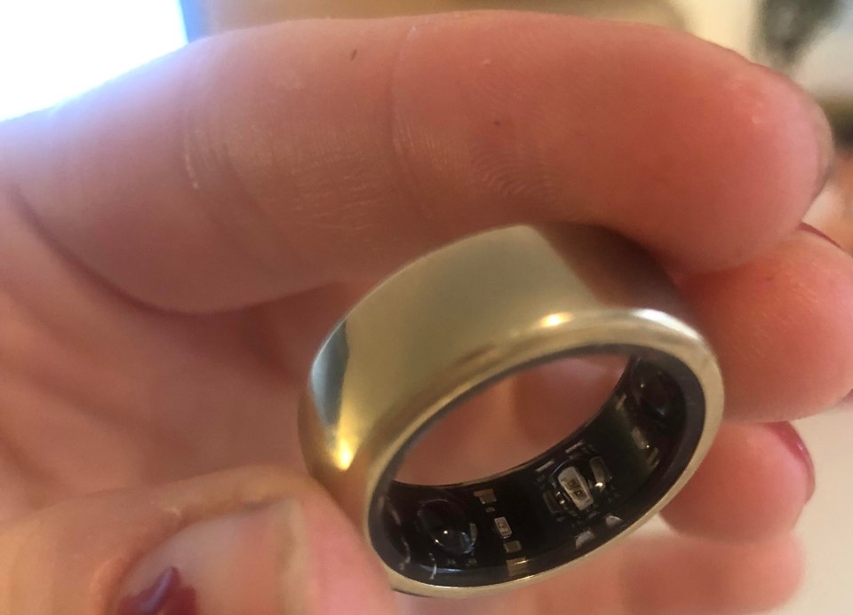 a person is holding a ring that says ' stainless steel ' on it