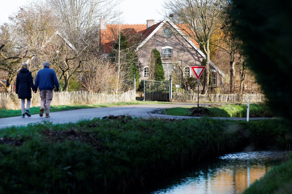 People walk on a street in the Dutch village Ommeren, Netherlands, near where the discovery suggests the loot might be hidden