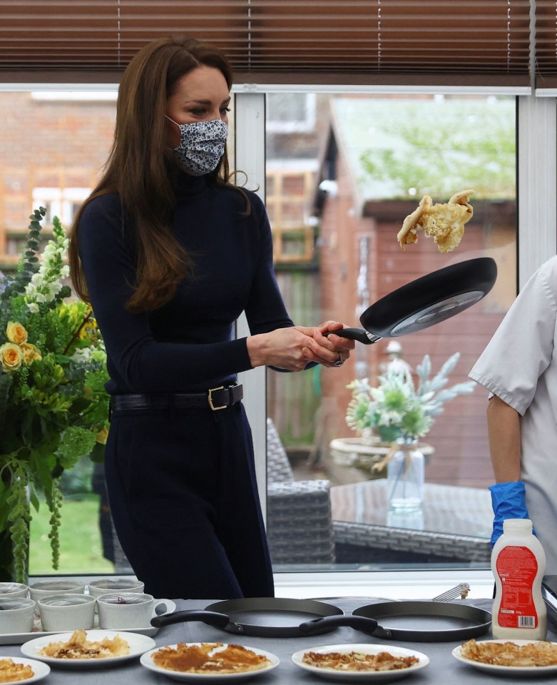 The Princess of Wales flipping a pancake.