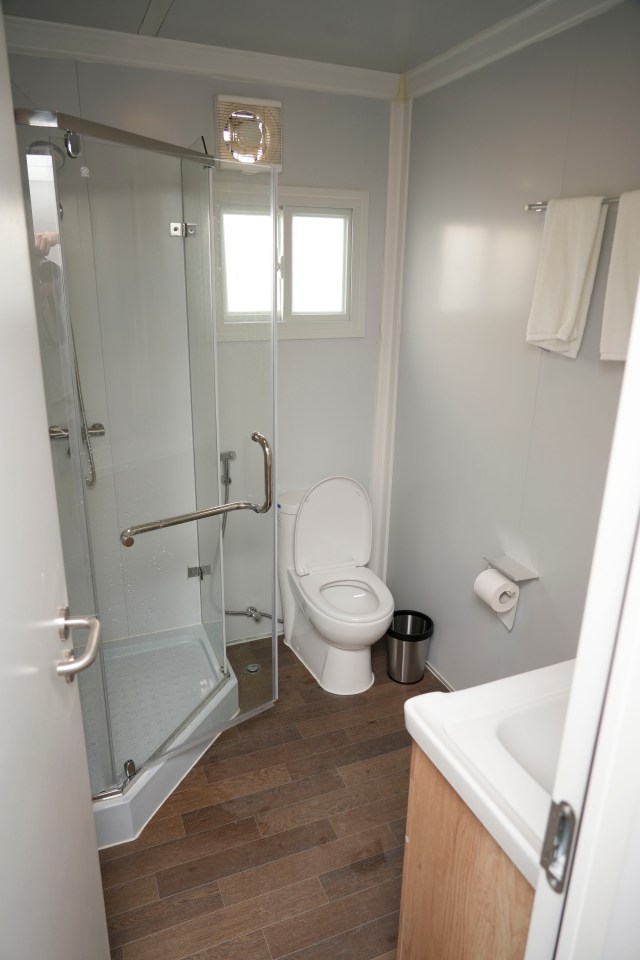 The converted containers had a toilet and shower