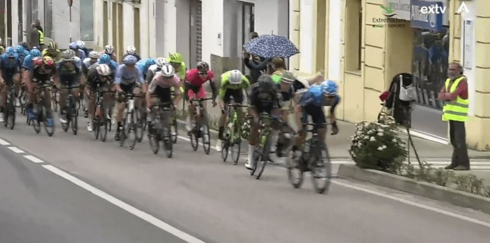The fan collided with a rider as the peloton whizzed by