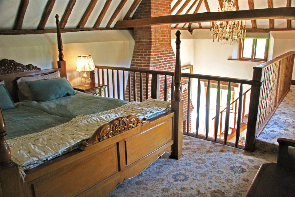 The inside of the cottage boasts oak beams and a mezzanine floor