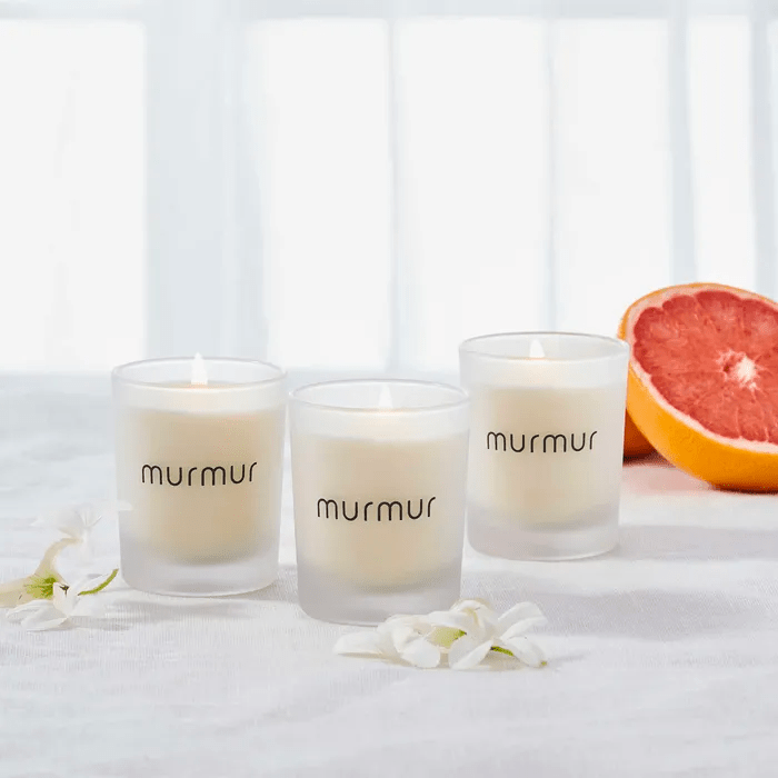 Three Murmur candles and a grapefruit.