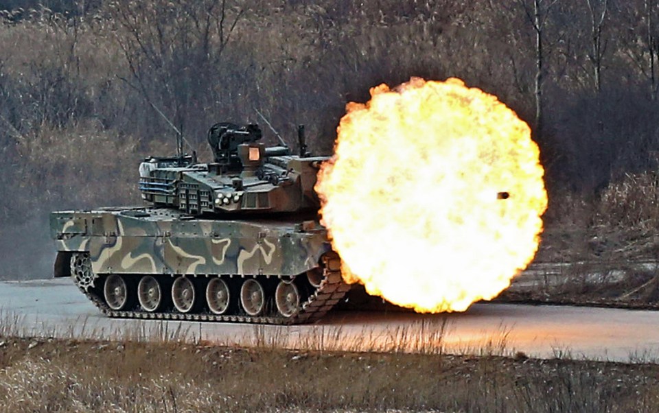 A South Korean army K-2 tank fires during a live firing drill