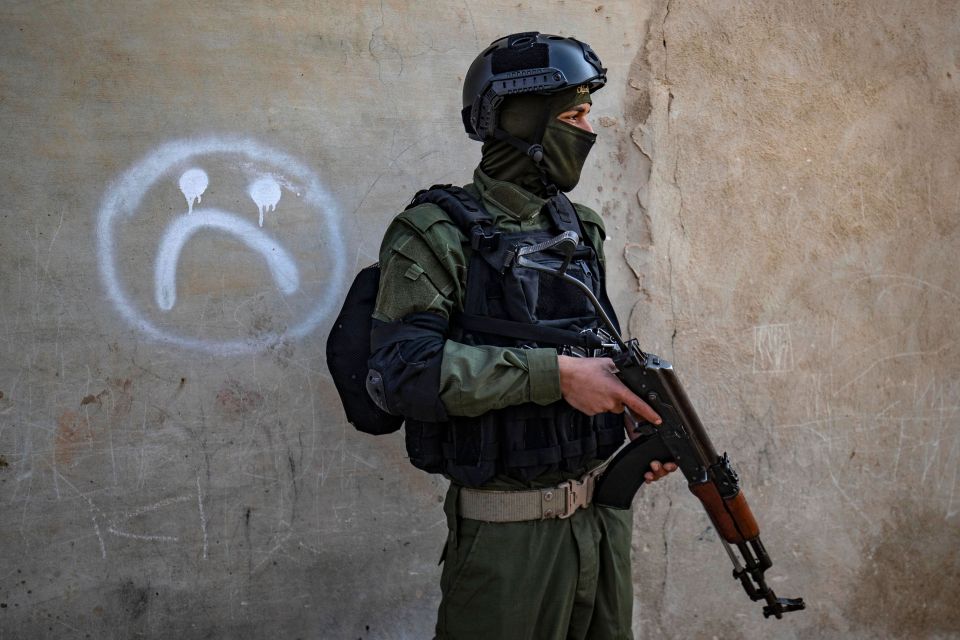 A member of the Syrian security forces during the raid on suspected ISIS fights in January