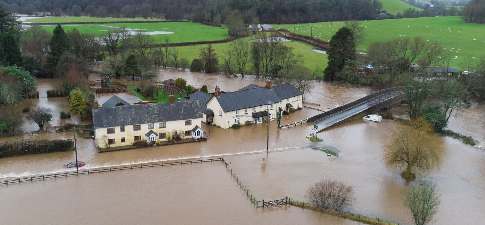 Mandatory Credit: Photo by Shutterstock (13712699g)..The Anchor Inn pub is flooded at Exebridge on the Somerset - Devon Border. .Nearby villages had in excess of 80mm of rain in 24hours from 0900 on Wednesday 11th January to 0900 on Thursday 12th January...River Exe Flooding, Dulverton and Exebridge, UK - 12 Jan 2023