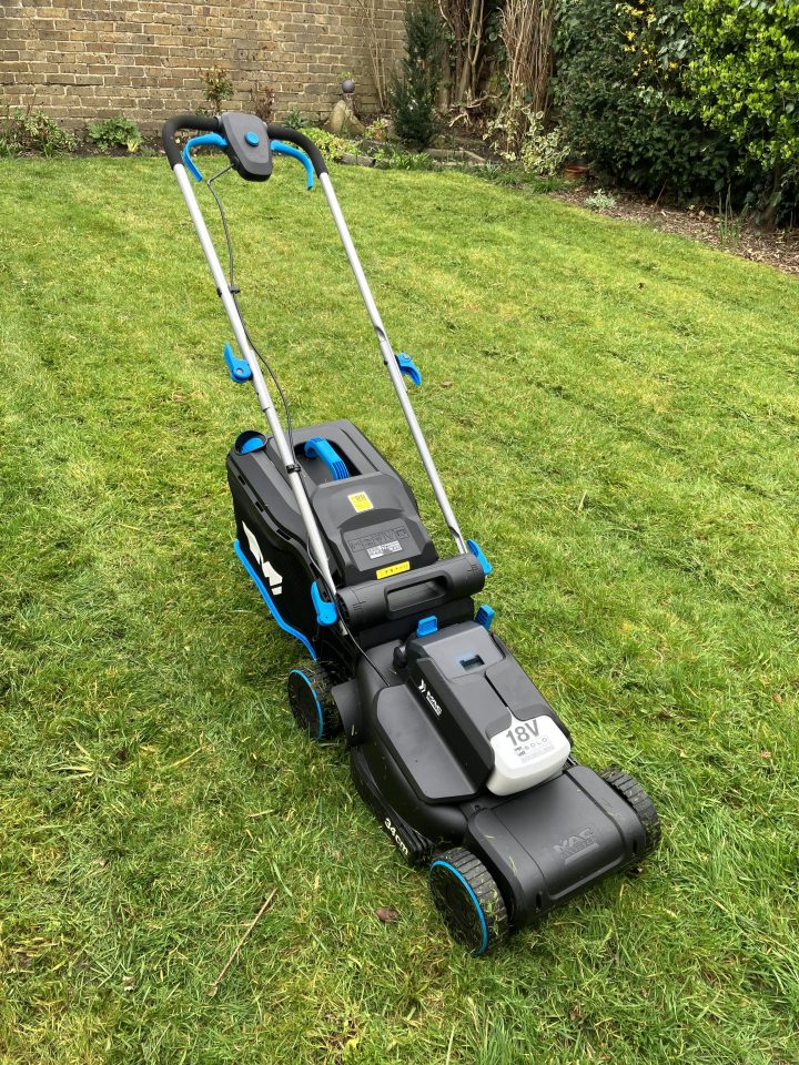 18V cordless lawnmower on a lawn.