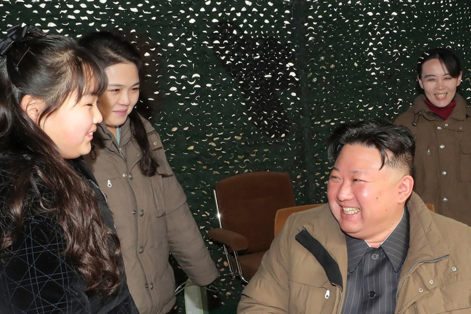 Kim's daughter, left, sister Kim Yo Jong, right, and Kim, second right