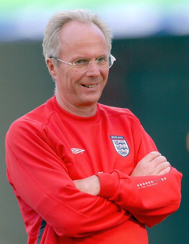 a man wearing a red sweatshirt that says england on it