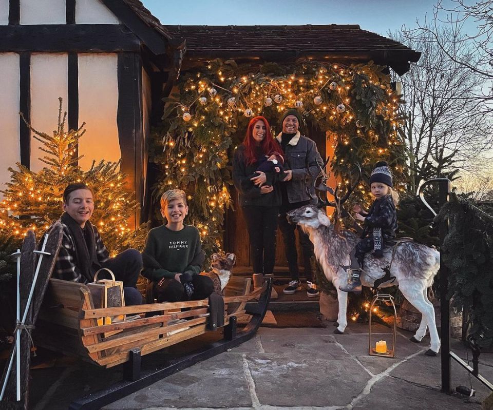 The family for their Christmas display outside the house