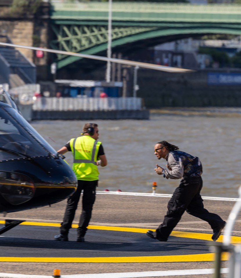 The F1 star jetted out of Battersea in a helicopter to Glastonbury on Sunday