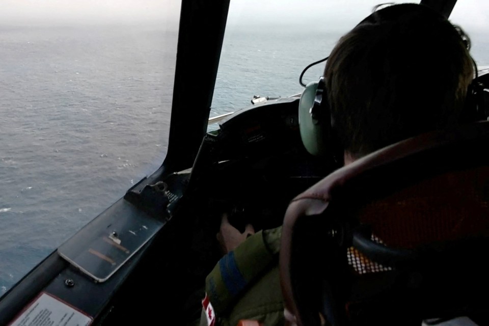 The pilot of a Royal Canadian Air Force CP-140 Aurora maritime surveillance aircraft of 14 Wing flies a search pattern for the missing OceanGate submersible, which had been carrying five people to explore the wreck of the sunken SS Titanic, in the Atlantic Ocean off Newfoundland, Canada June 20, 2023 in a still image from video. Canadian Forces/Handout via REUTERS THIS IMAGE HAS BEEN SUPPLIED BY A THIRD PARTY.