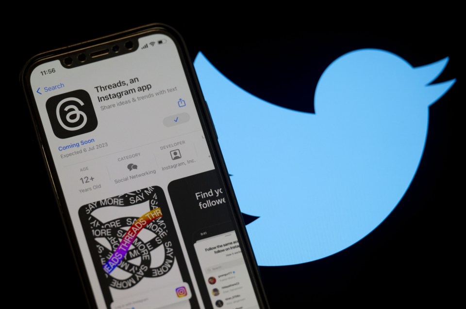 ANKARA, TURKIYE - JULY 04: The logo of Threads is displayed on a mobile phone screen in front of a computer screen displaying the logo of Twitter in Ankara, Turkiye on July 04, 2023. (Photo by Emin Sansar/Anadolu Agency via Getty Images)